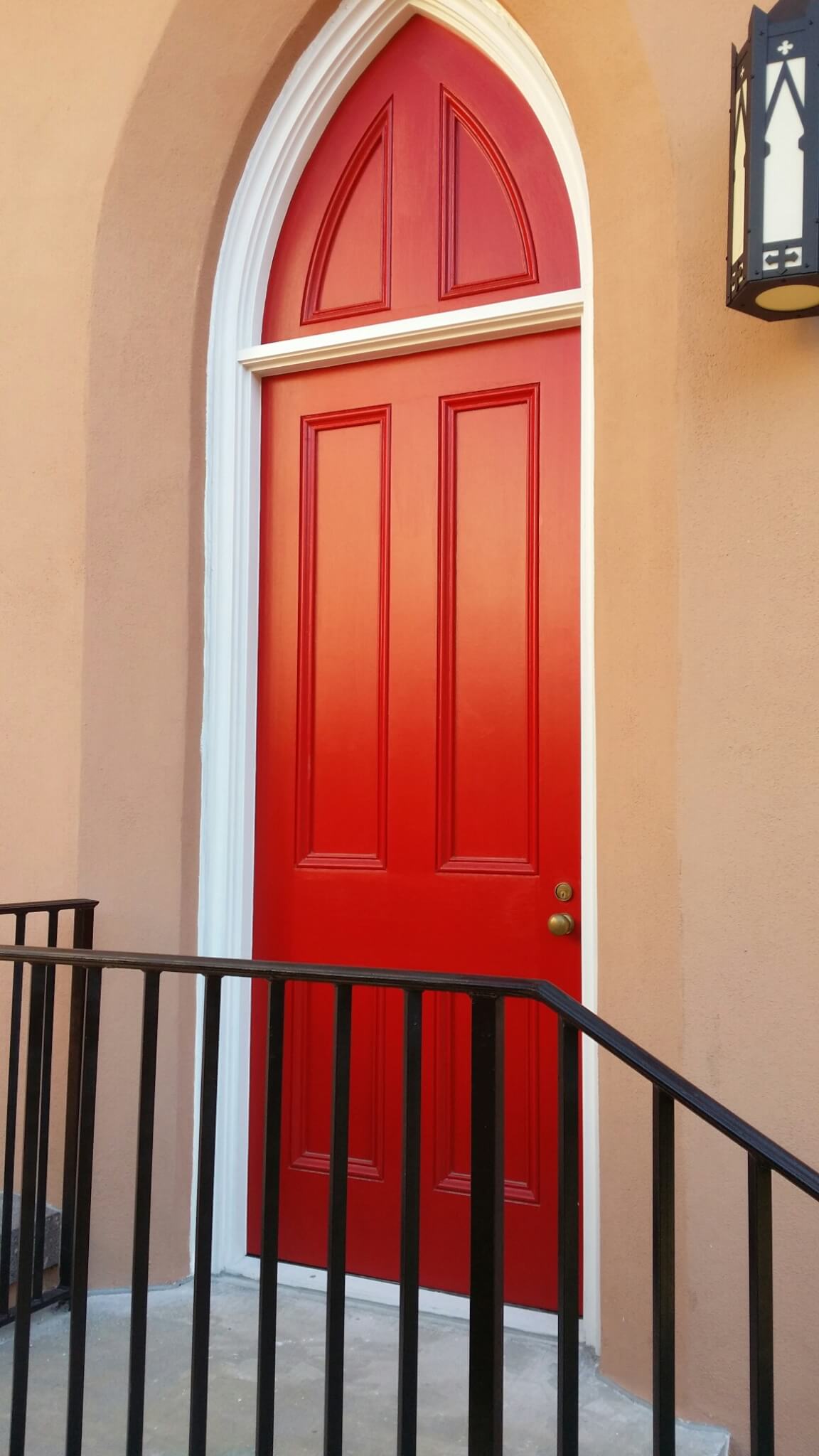 arched red wooden door