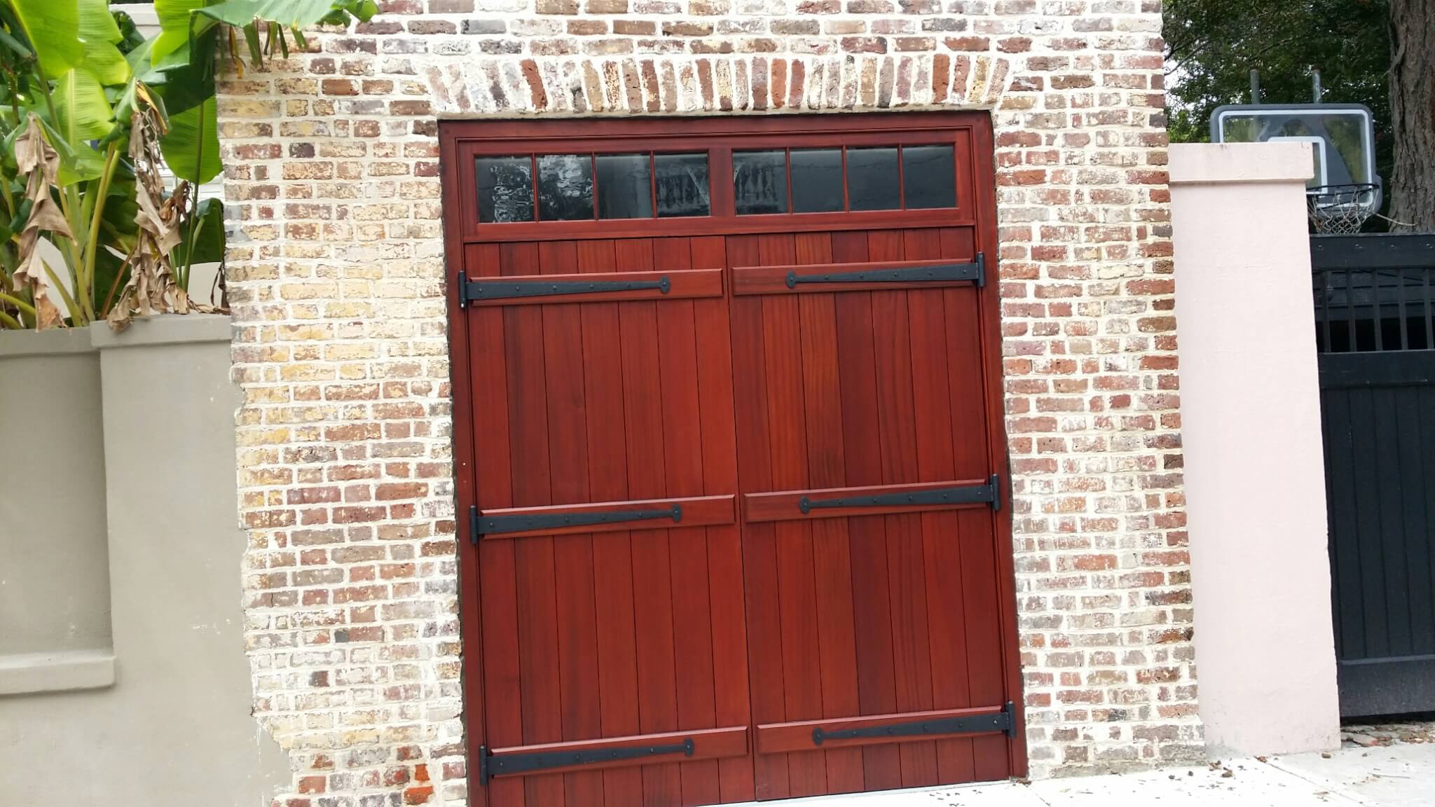 Elegant custom wood door with glass panel in Charleston by MW Millworks