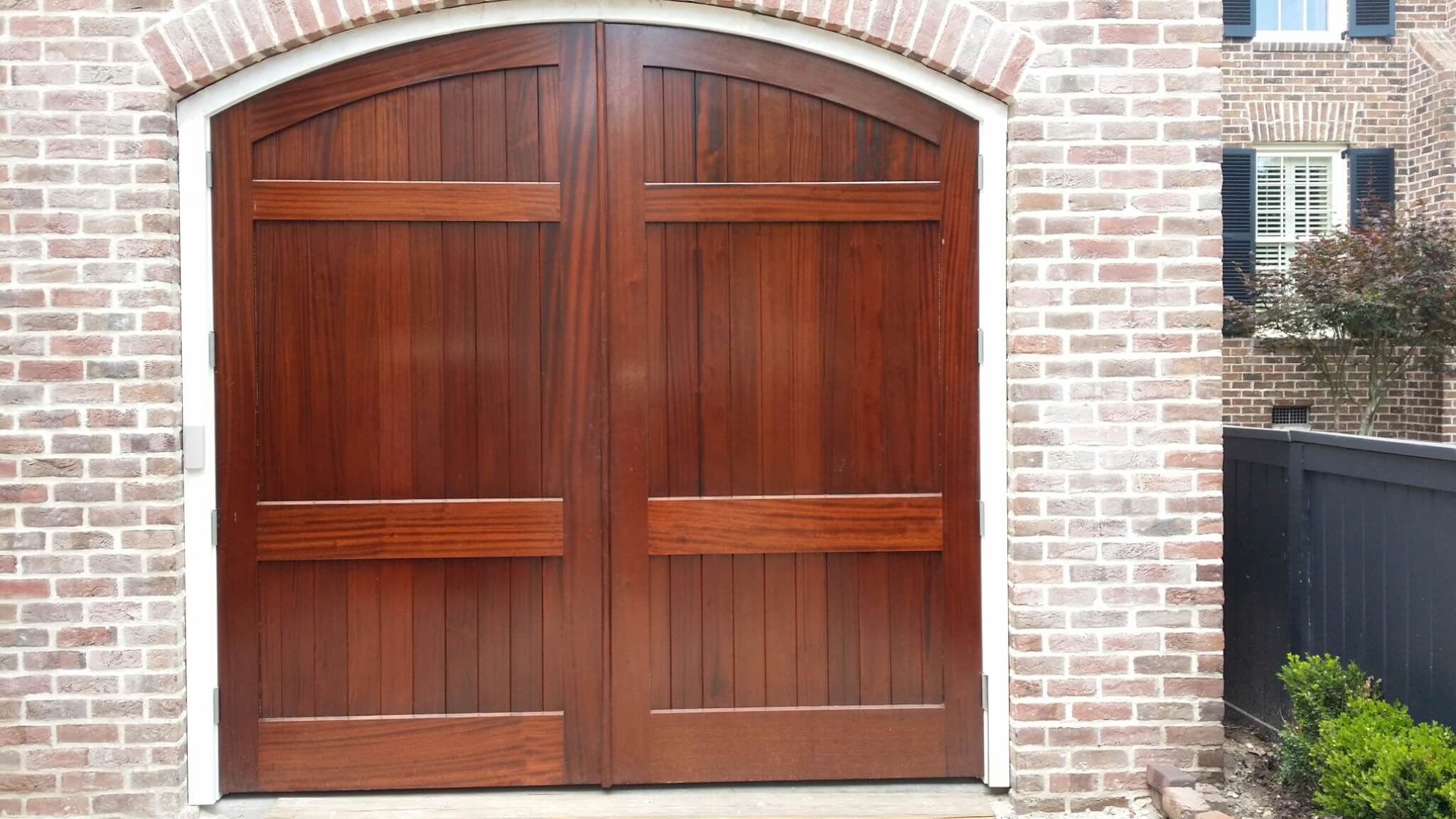 Custom wood door with intricate design in Charleston by MW Millworks