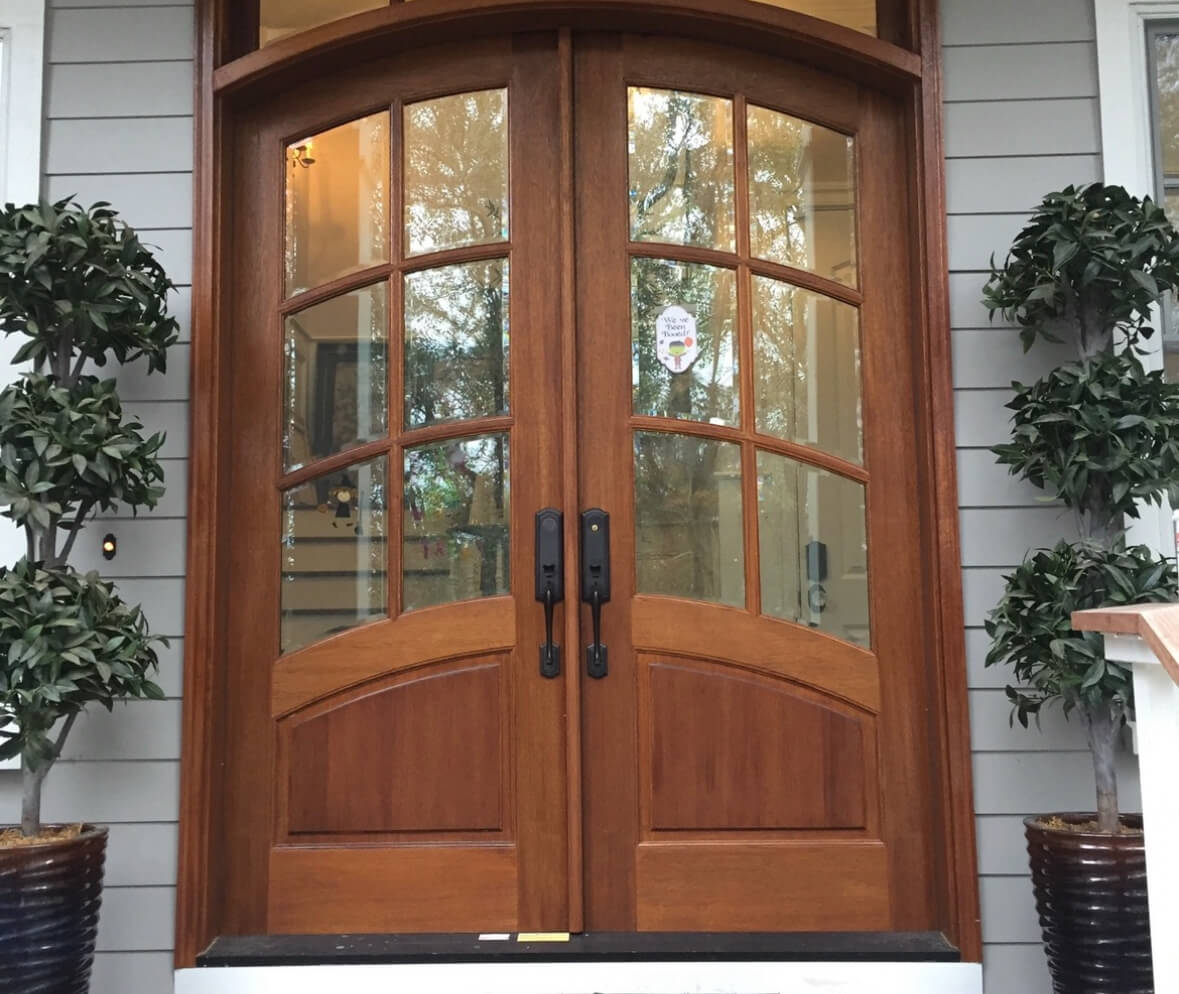 Custom wooden front door with decorative glass in Charleston by MW Millworks