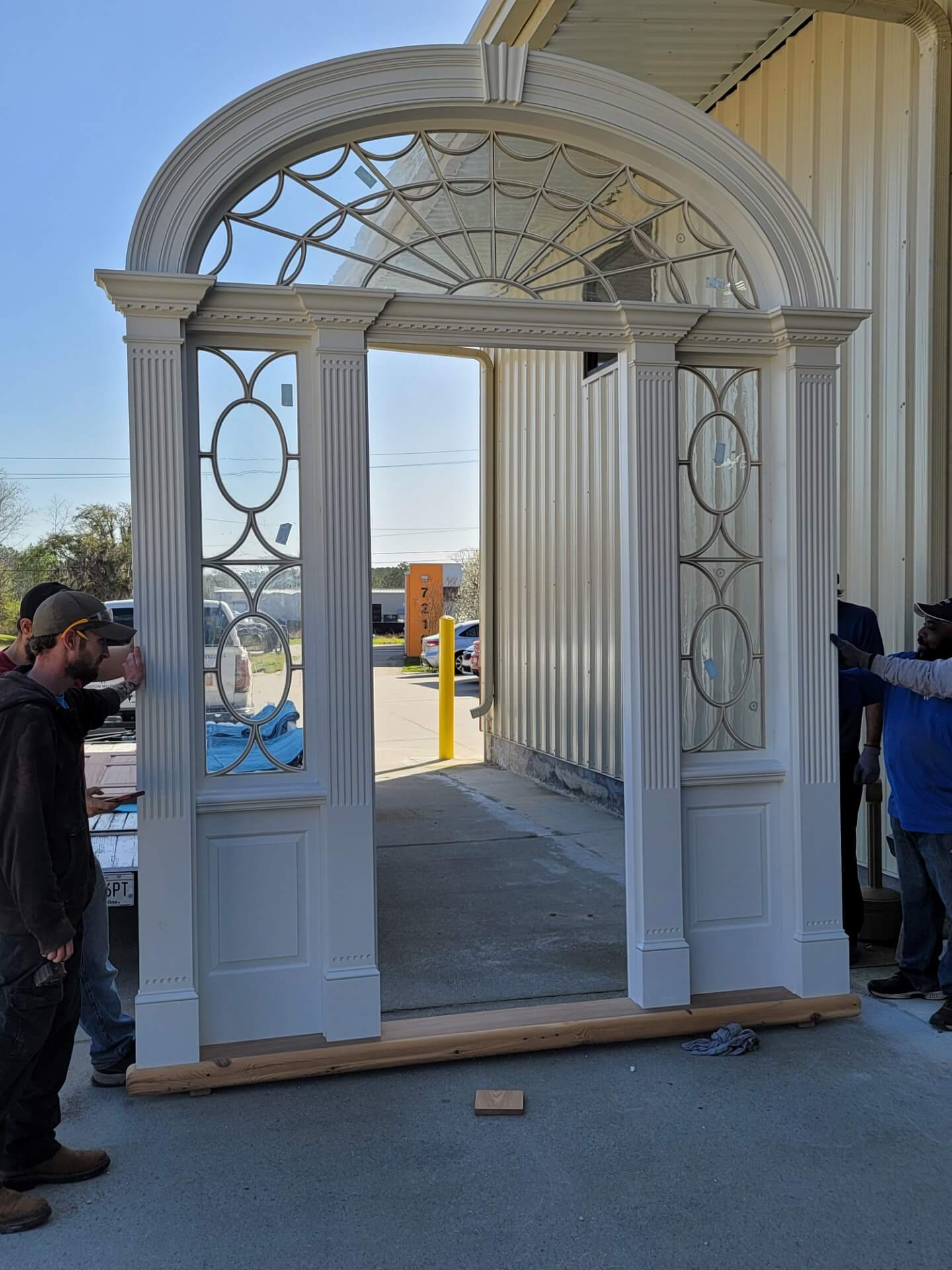 Large sidelight window with custom wood framing in Charleston by MW Millworks