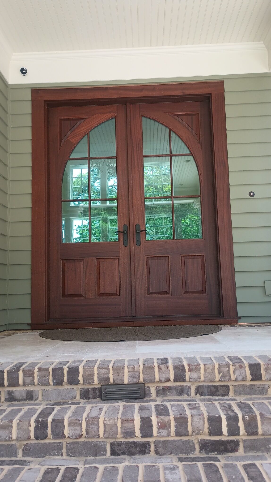 Custom door with radius top design in Charleston by MW Millworks